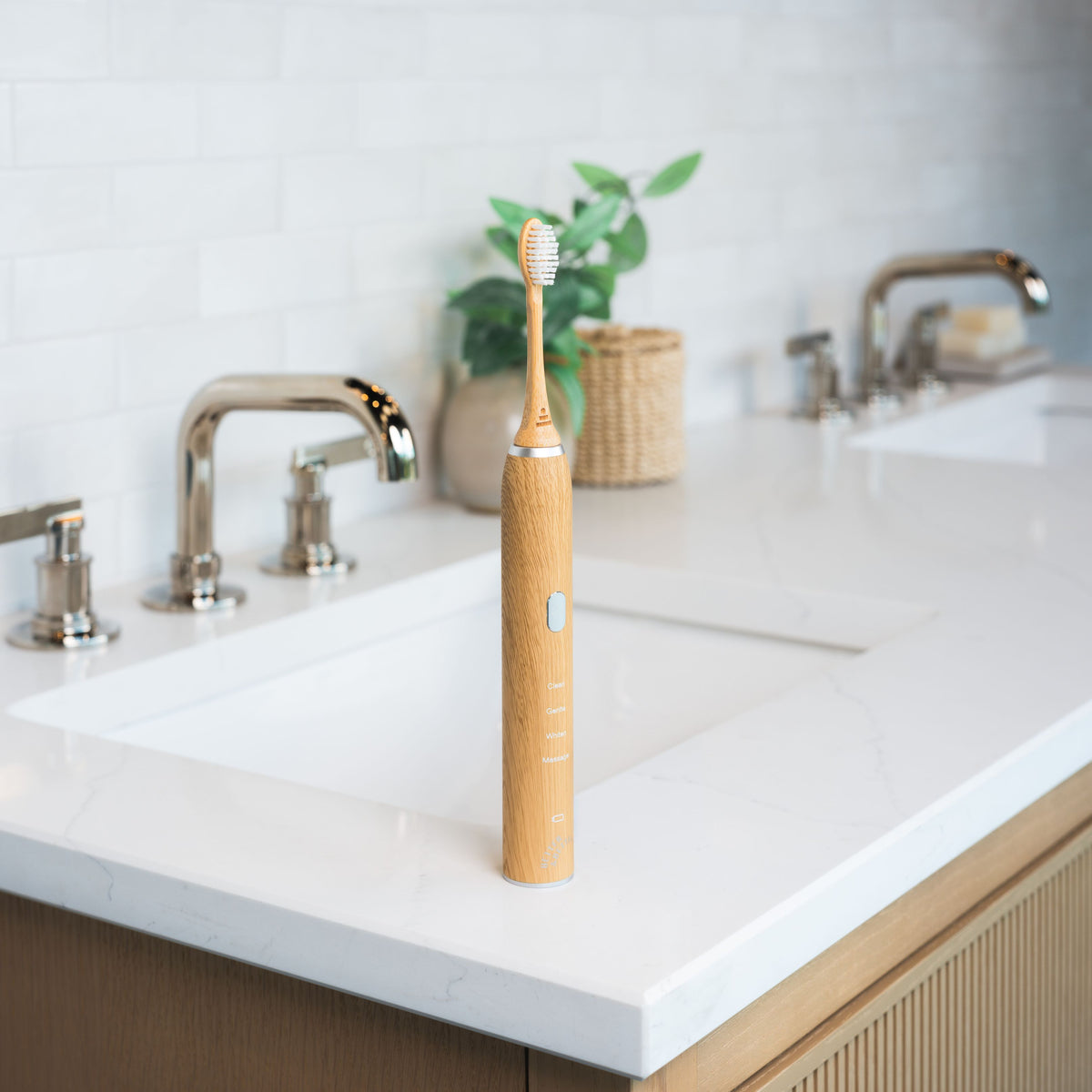 Bamboo Sonic Toothbrush (2.0) on a bathroom sink, wide view