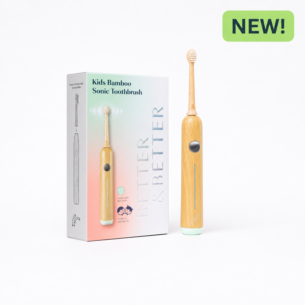 Kids bamboo sonic toothbrush shown next to its packaging box, with a green 'NEW!' badge in the top right corner. The toothbrush features a light natural bamboo handle, a mint green base, and a black button, while the box displays the product name 'Kids Bamboo Sonic Toothbrush' and 'BETTER & BETTER' branding.
