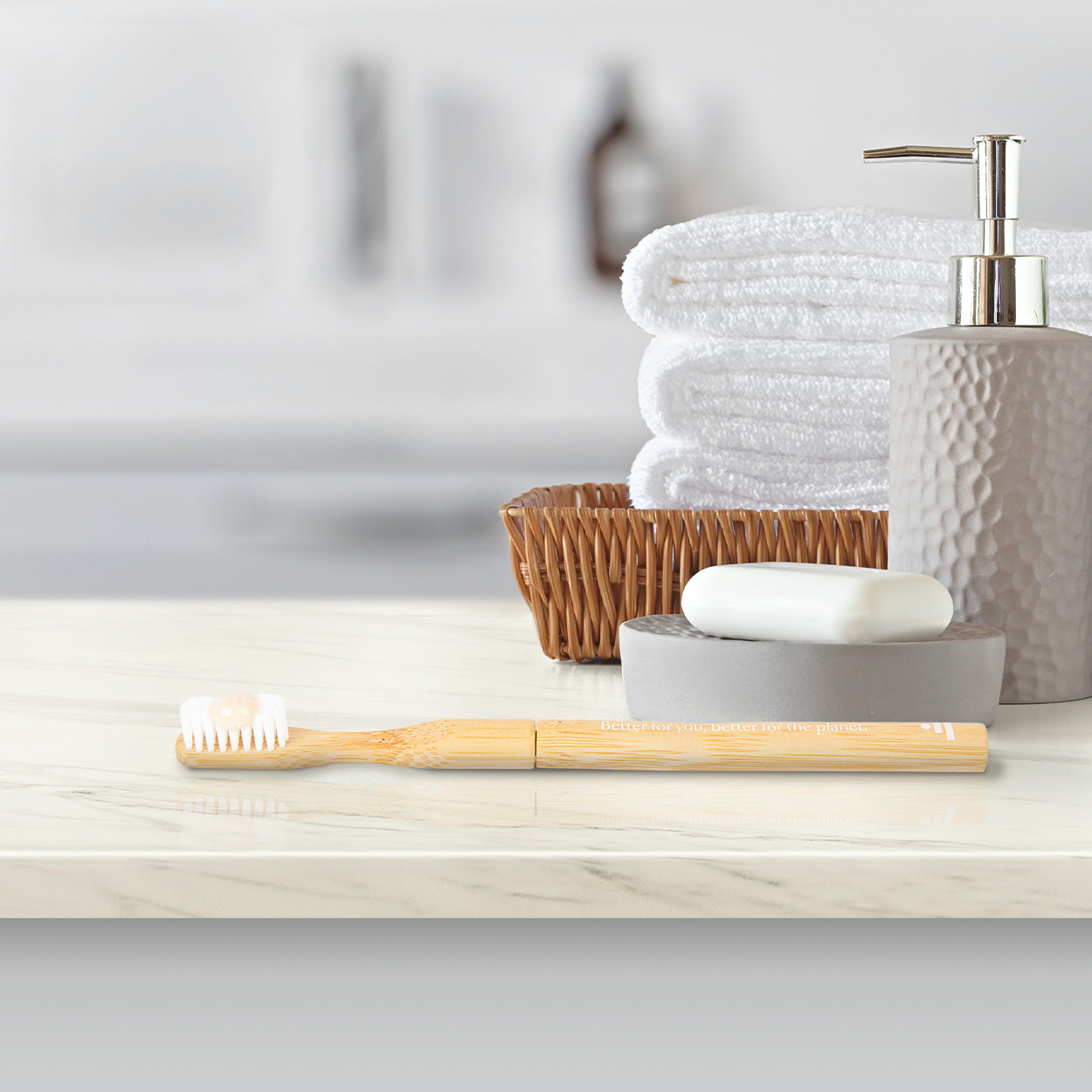 Hover | Better & Better Natural Bamboo Toothbrush on Bathroom Counter with Pea-sized amount of Better & Better Toothpaste